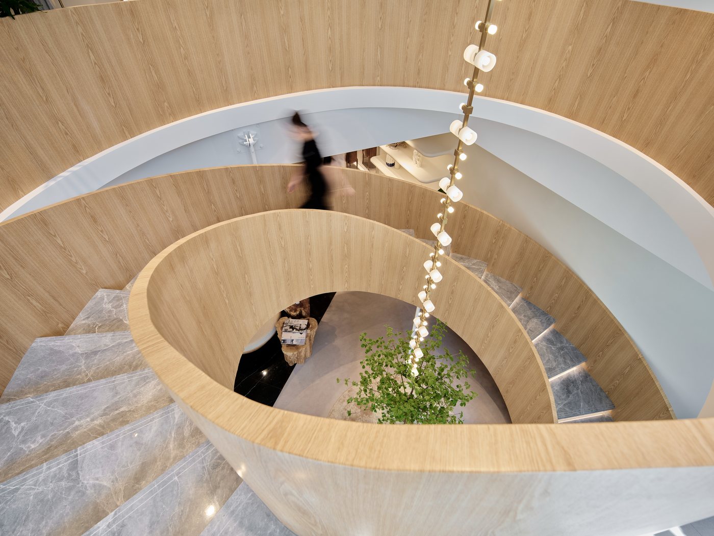 Sculptural staircase inside DAZZLE Maison